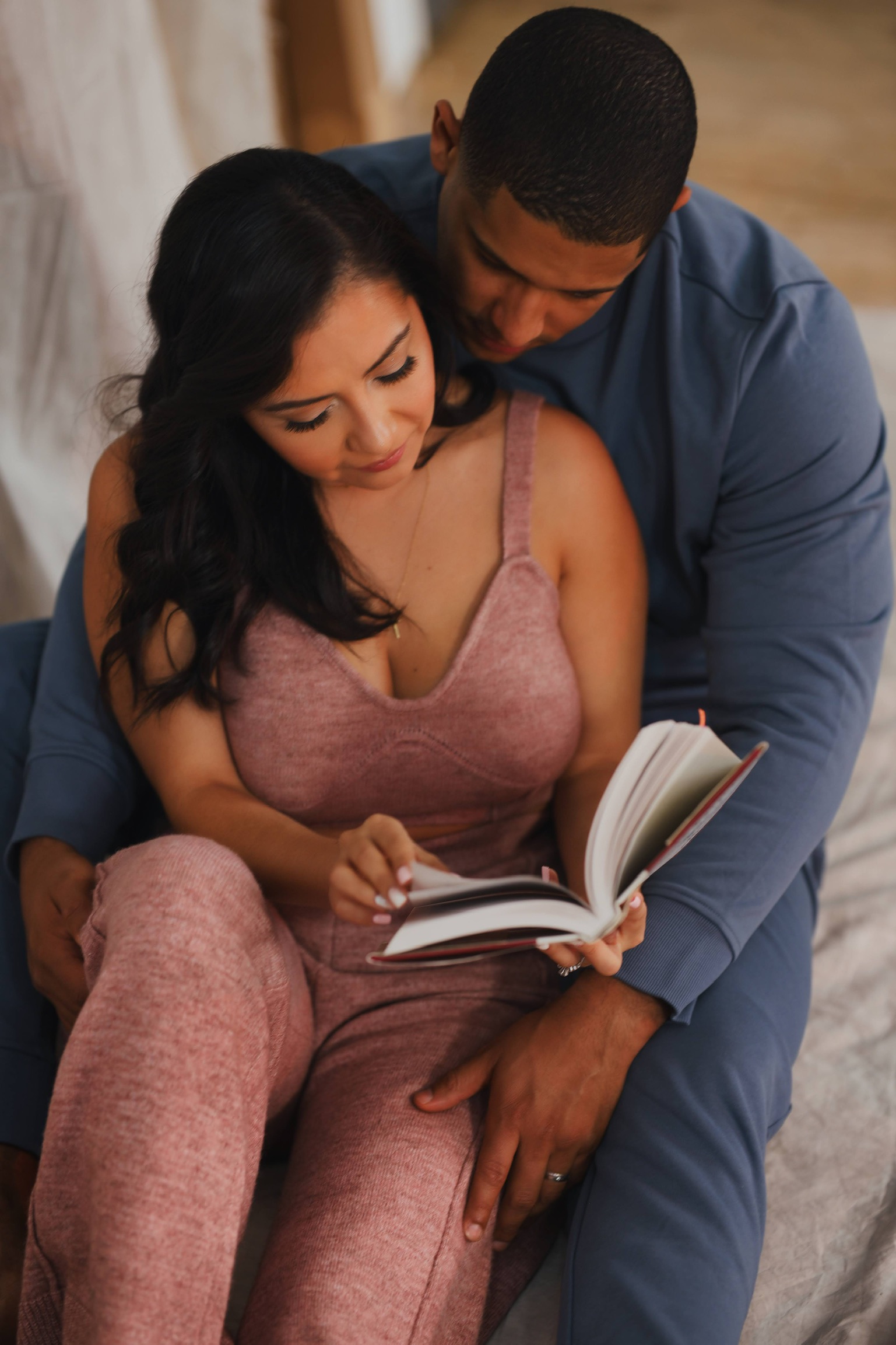 Henry and Alexandra reading together in a quiet moment